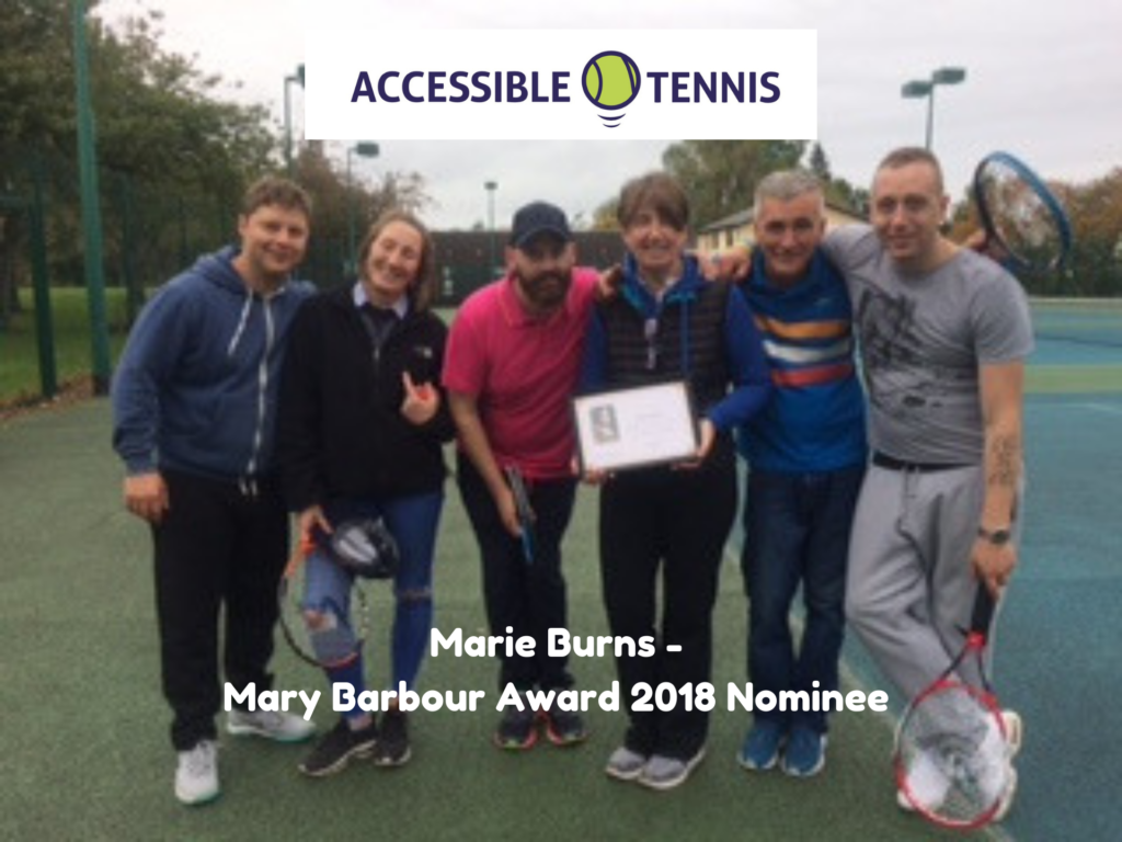 Marie Burns holding a certificate along with a group of tennis players