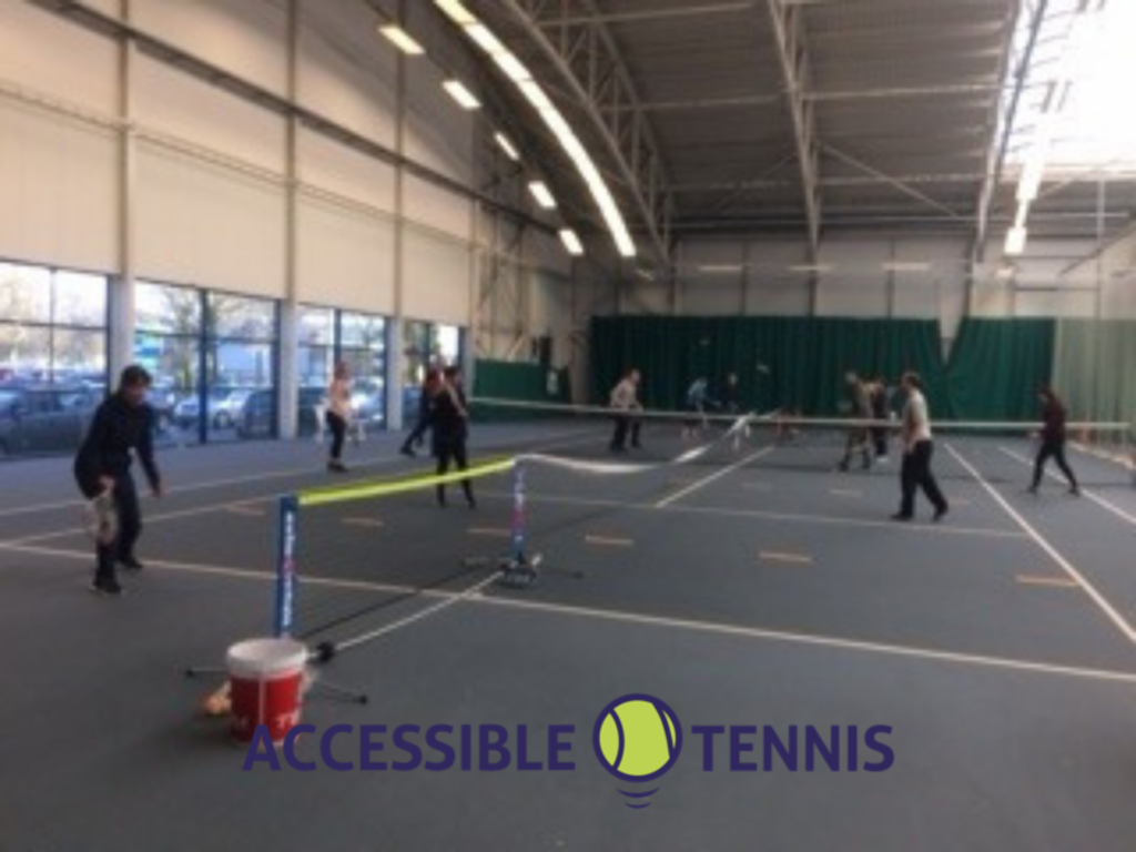 Tennis players on an indoor court at the Gorbals
